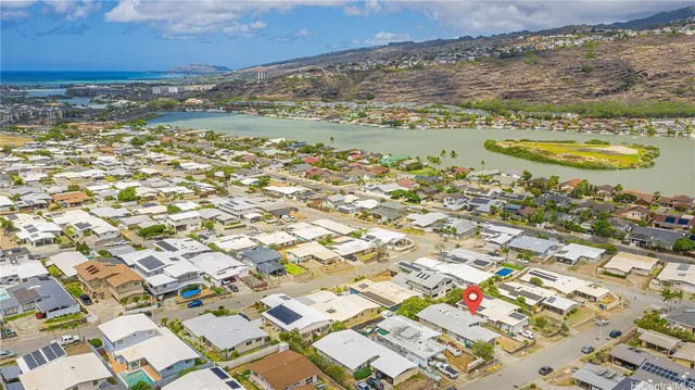 an aerial view of residential building and parking space