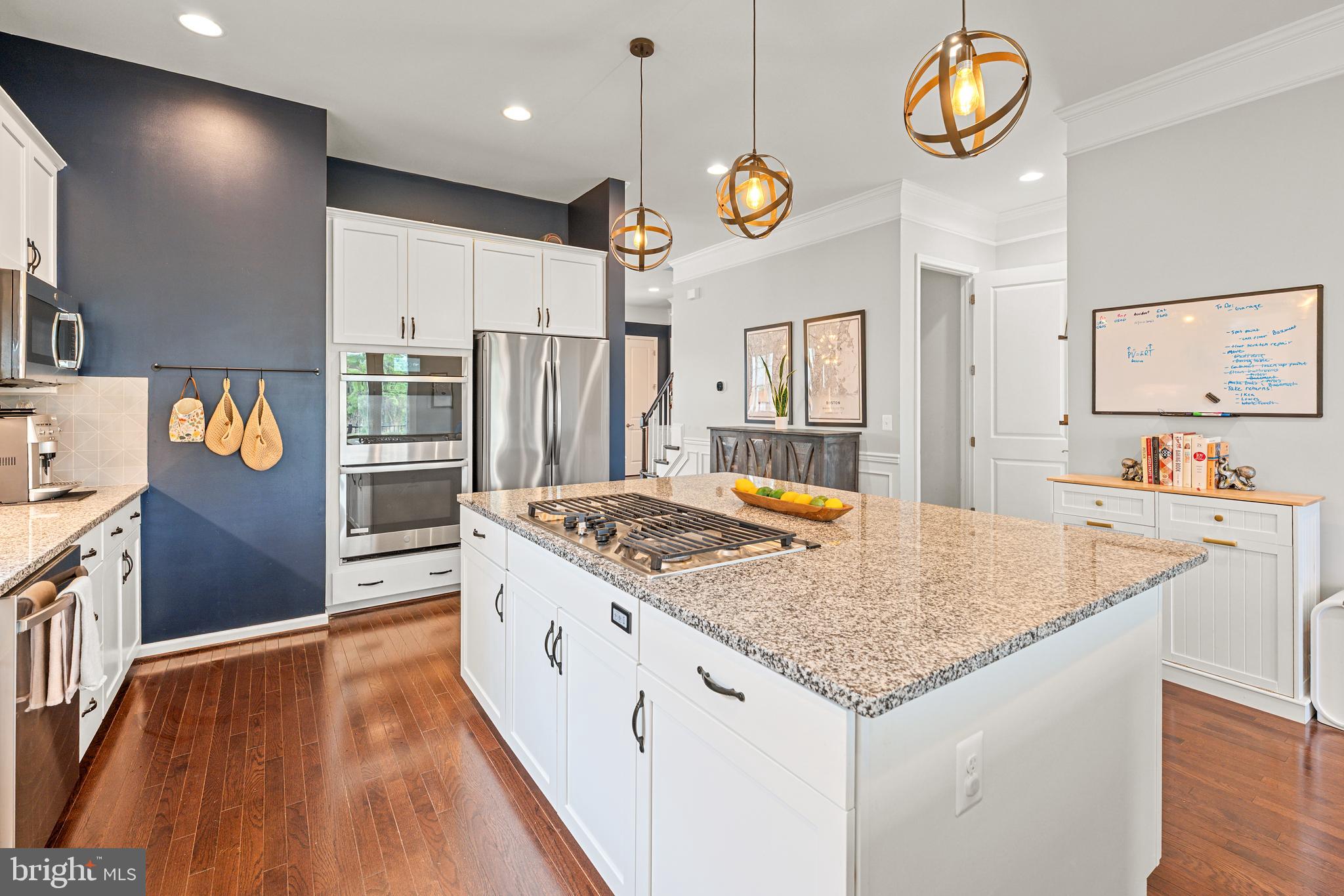 8459 Reformatory Way Lorton, VA 22079 - Photo 15 of 78 a kitchen with stainless steel appliances granite countertop a stove and refrigerator