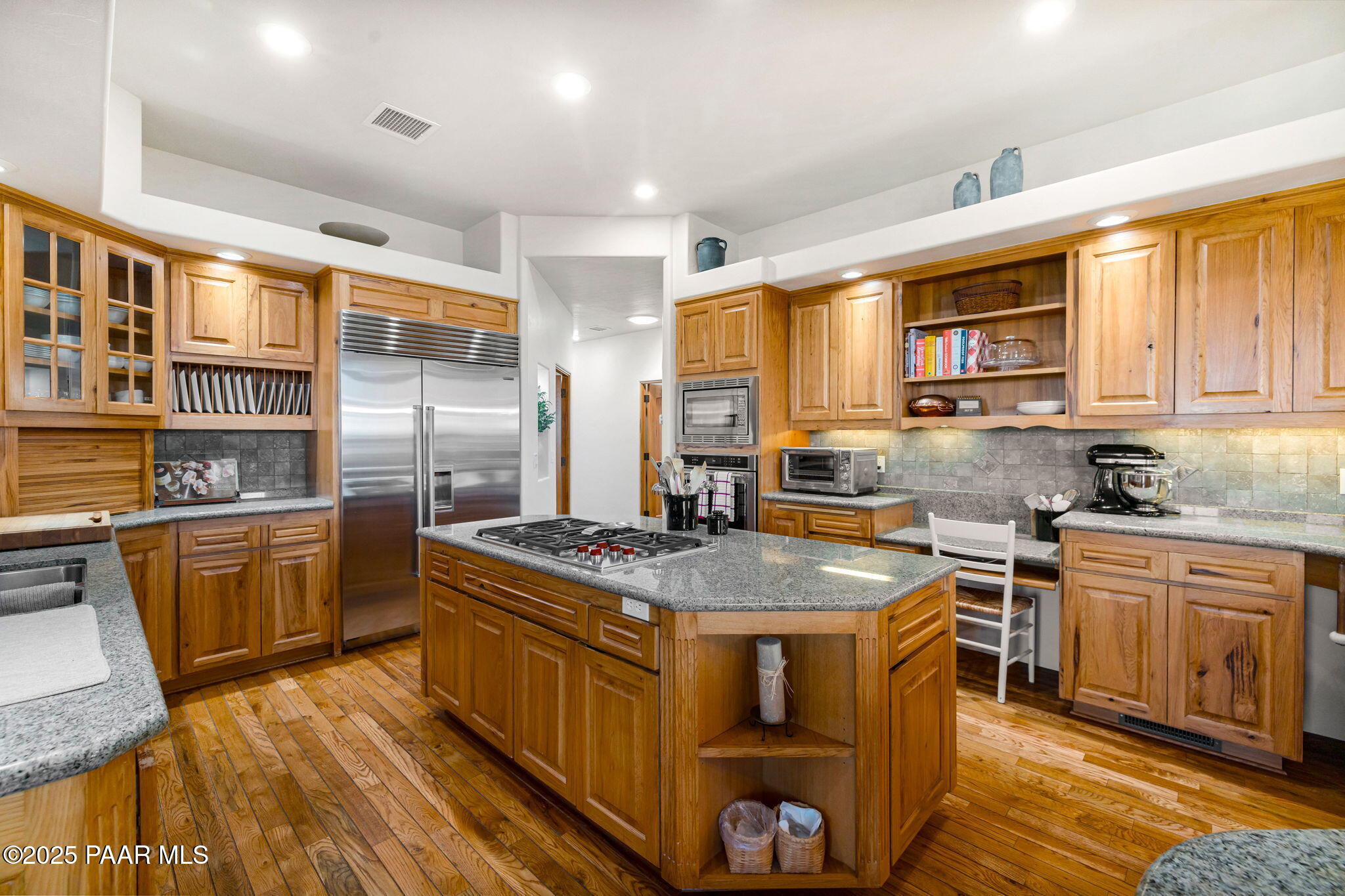 13995 North Thunderbird Road, Unit 74 Prescott, AZ 86305 - Photo 16 of 63 a kitchen with stainless steel appliances granite countertop a stove a sink dishwasher and a refrigerator