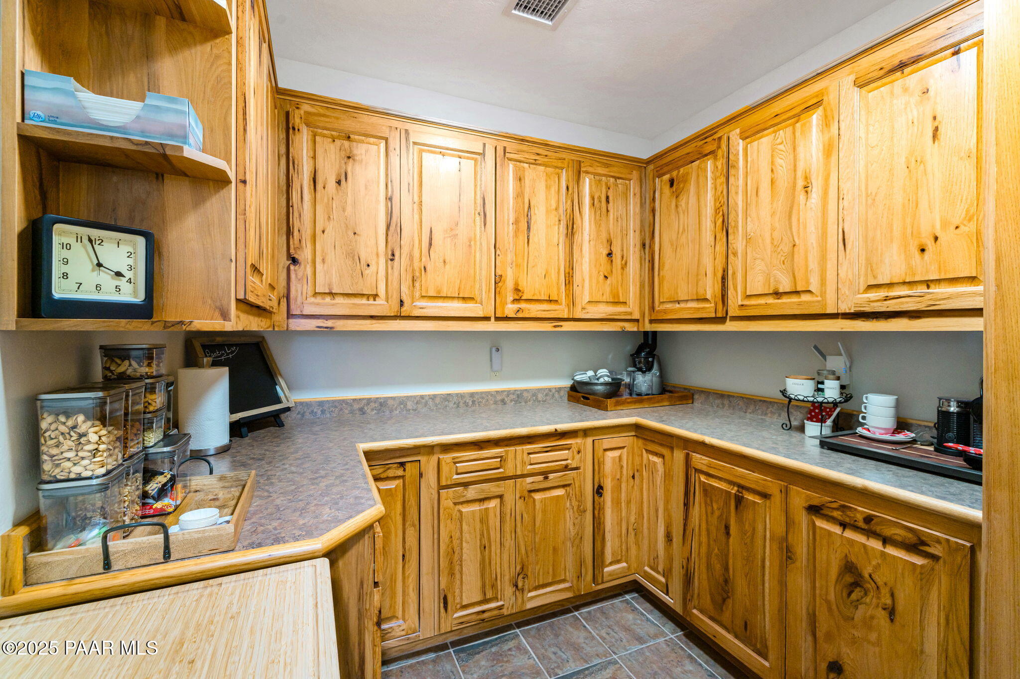 13995 North Thunderbird Road, Unit 74 Prescott, AZ 86305 - Photo 23 of 63 a kitchen with stainless steel appliances granite countertop a sink dishwasher stove and cabinets with wooden floor