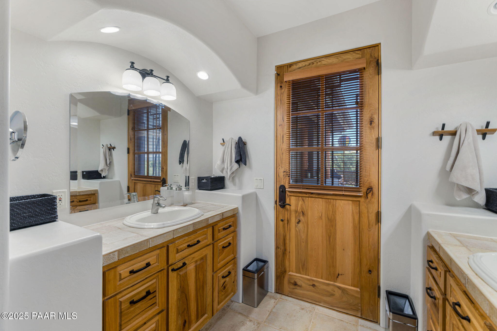13995 North Thunderbird Road, Unit 74 Prescott, AZ 86305 - Photo 28 of 63 a spacious bathroom with a sink double vanity and a mirror