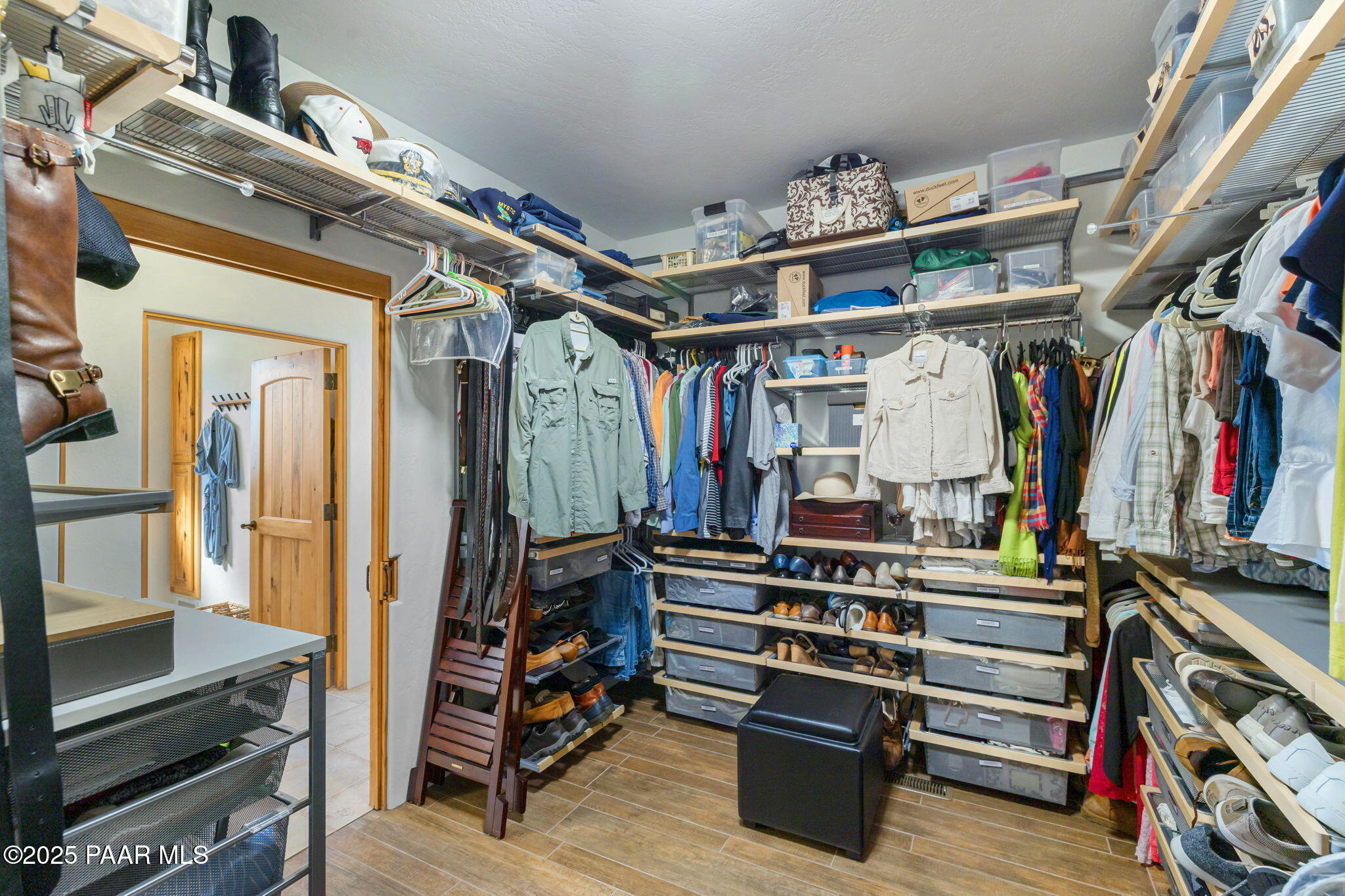 13995 North Thunderbird Road, Unit 74 Prescott, AZ 86305 - Photo 32 of 63 a view of walk in closet with clothes and shoes