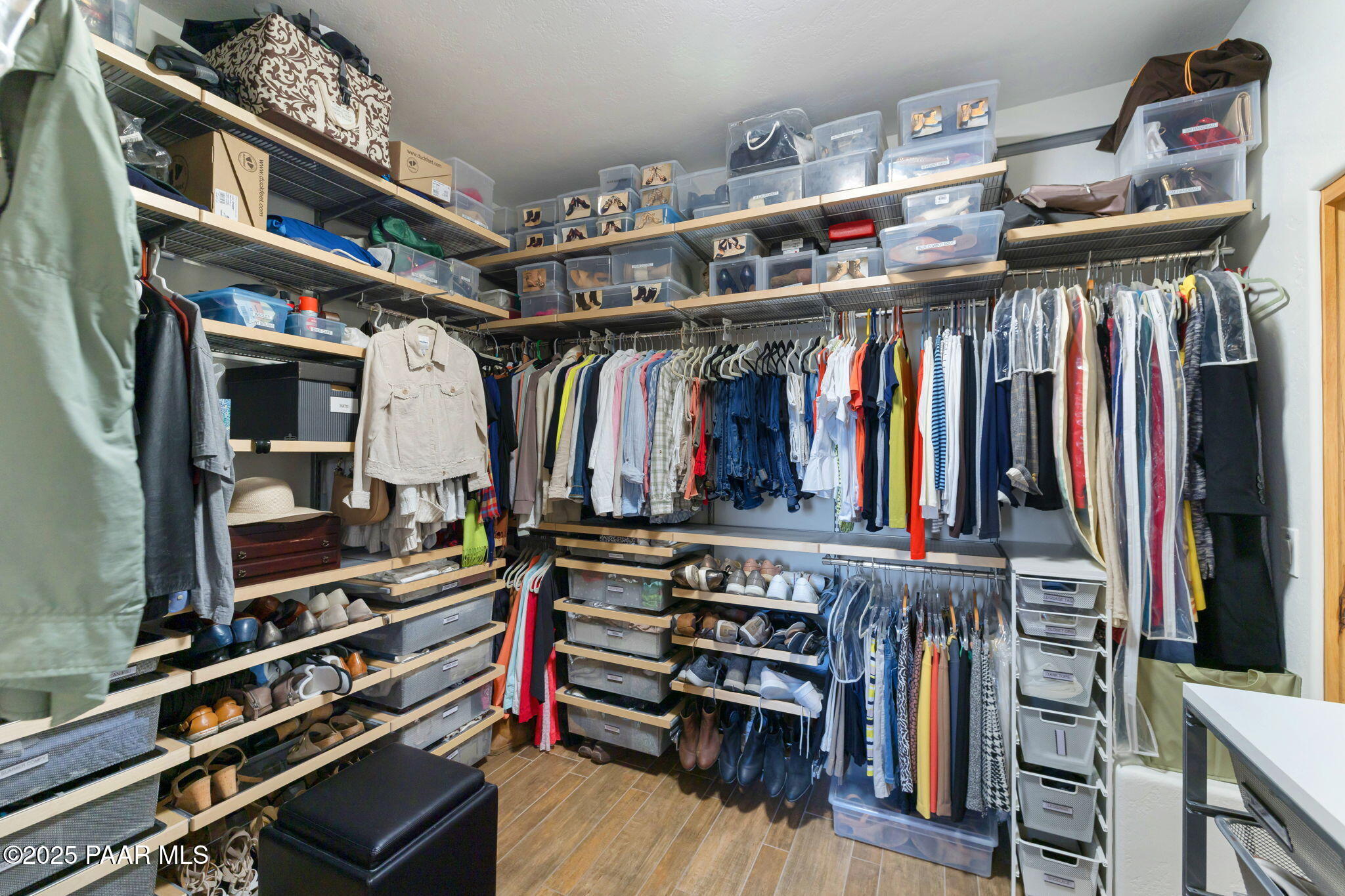 13995 North Thunderbird Road, Unit 74 Prescott, AZ 86305 - Photo 33 of 63 a view of walk in closet with clothes and shoes