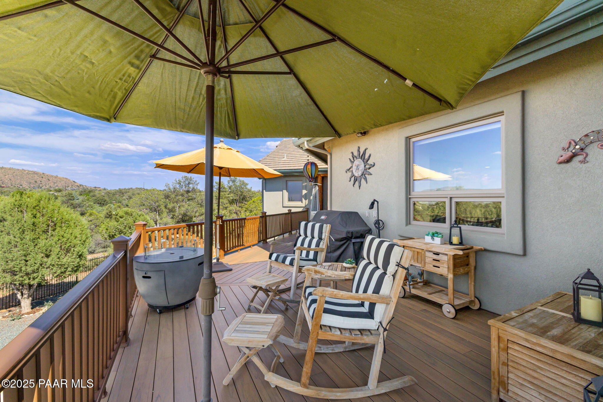 13995 North Thunderbird Road, Unit 74 Prescott, AZ 86305 - Photo 41 of 63 a view of balcony with furniture and umbrella