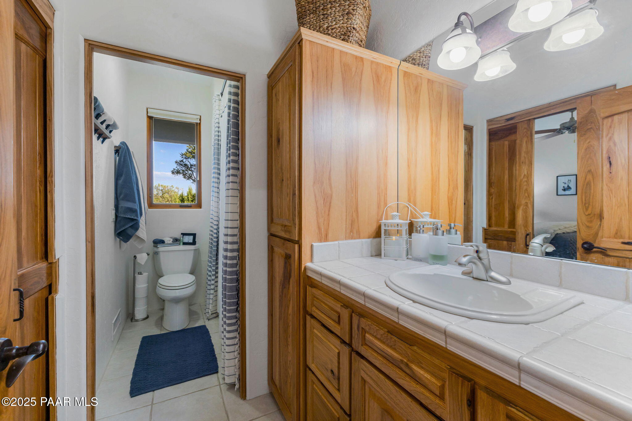 13995 North Thunderbird Road, Unit 74 Prescott, AZ 86305 - Photo 44 of 63 a bathroom with a sink and a mirror