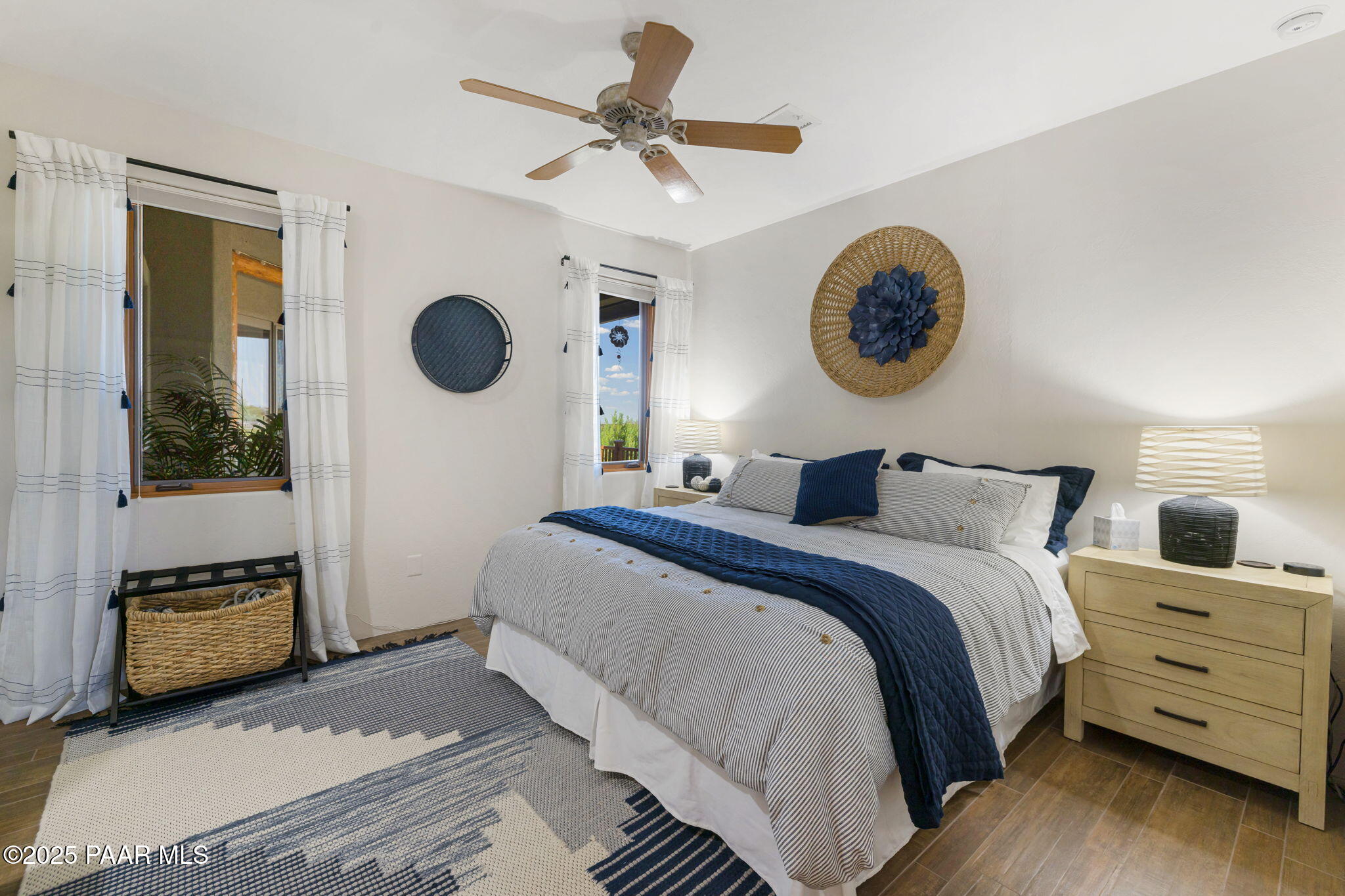 13995 North Thunderbird Road, Unit 74 Prescott, AZ 86305 - Photo 45 of 63 a bedroom with a bed and a chandelier