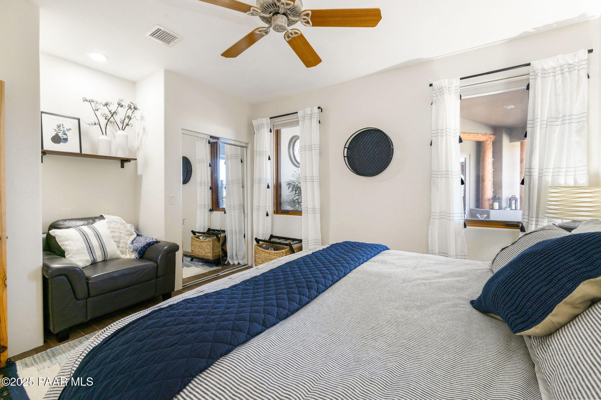 13995 North Thunderbird Road, Unit 74 Prescott, AZ 86305 - Photo 46 of 63 a bedroom with bed and a couch