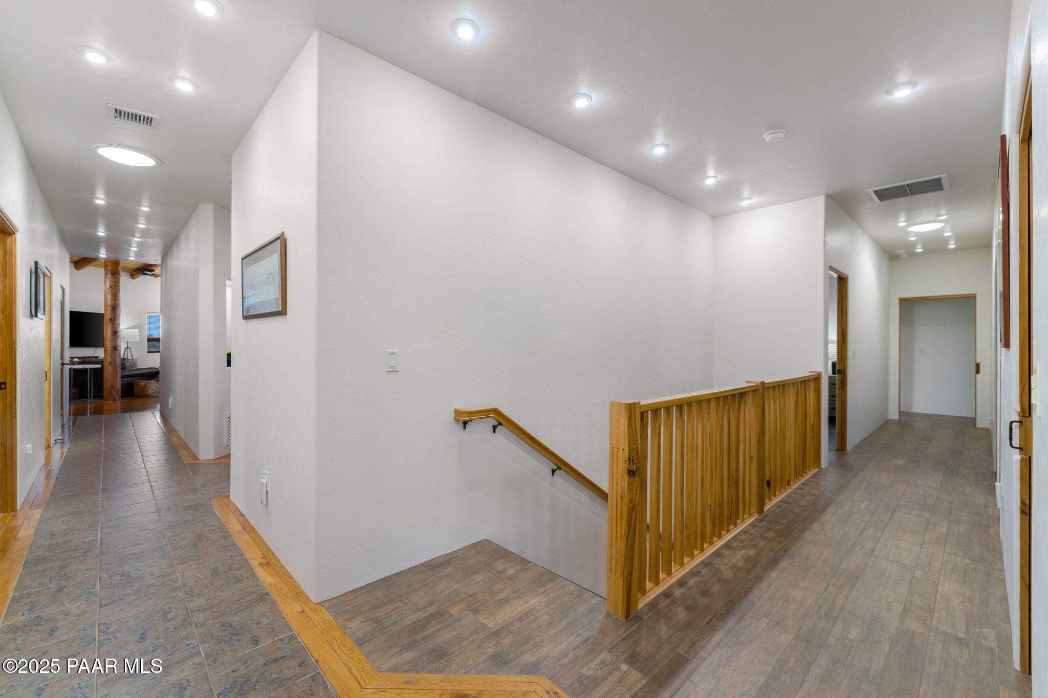 13995 North Thunderbird Road, Unit 74 Prescott, AZ 86305 - Photo 49 of 63 a view of a hallway with wooden floor and staircase