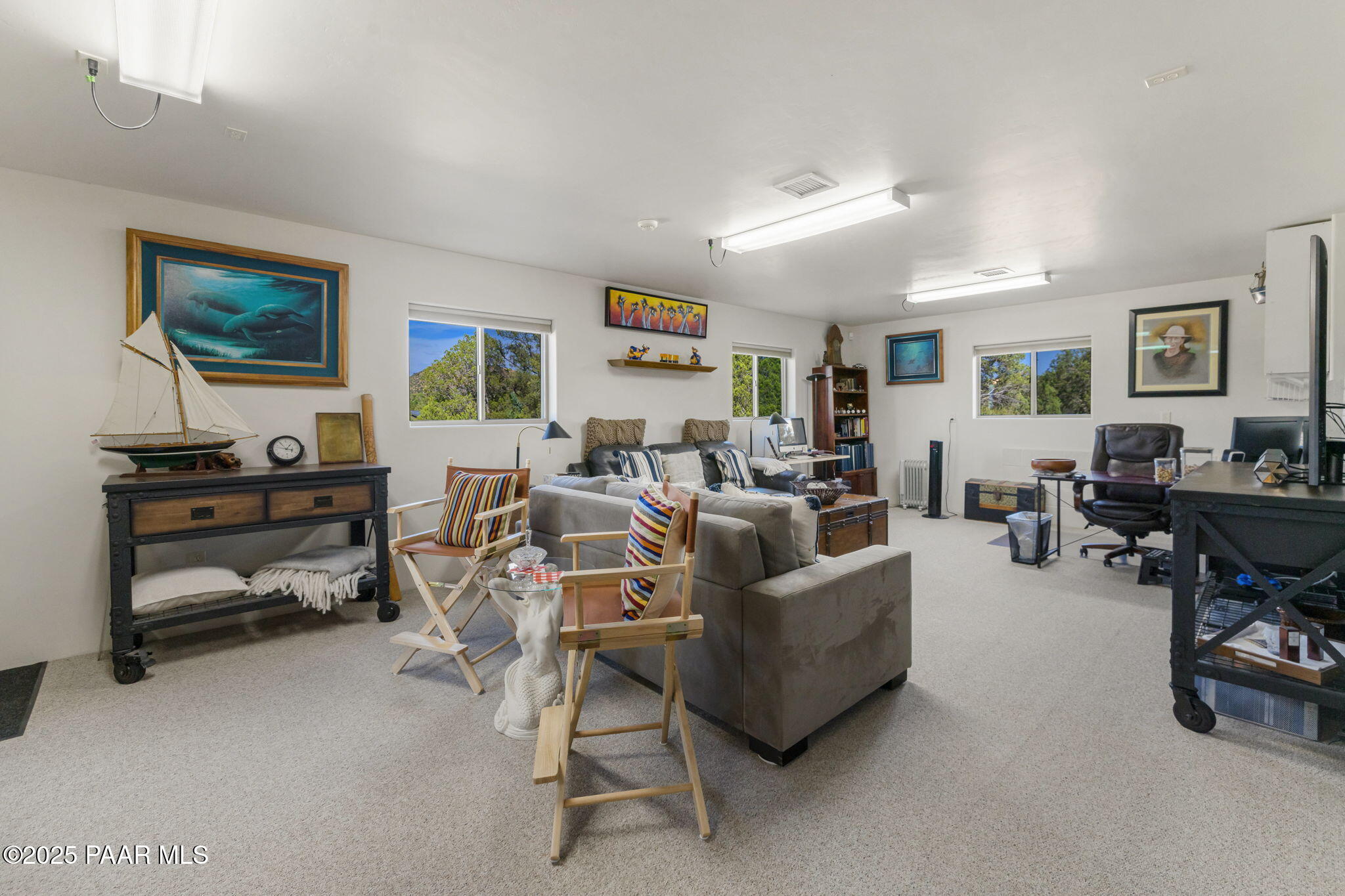 13995 North Thunderbird Road, Unit 74 Prescott, AZ 86305 - Photo 50 of 63 a living room with furniture and a flat screen tv