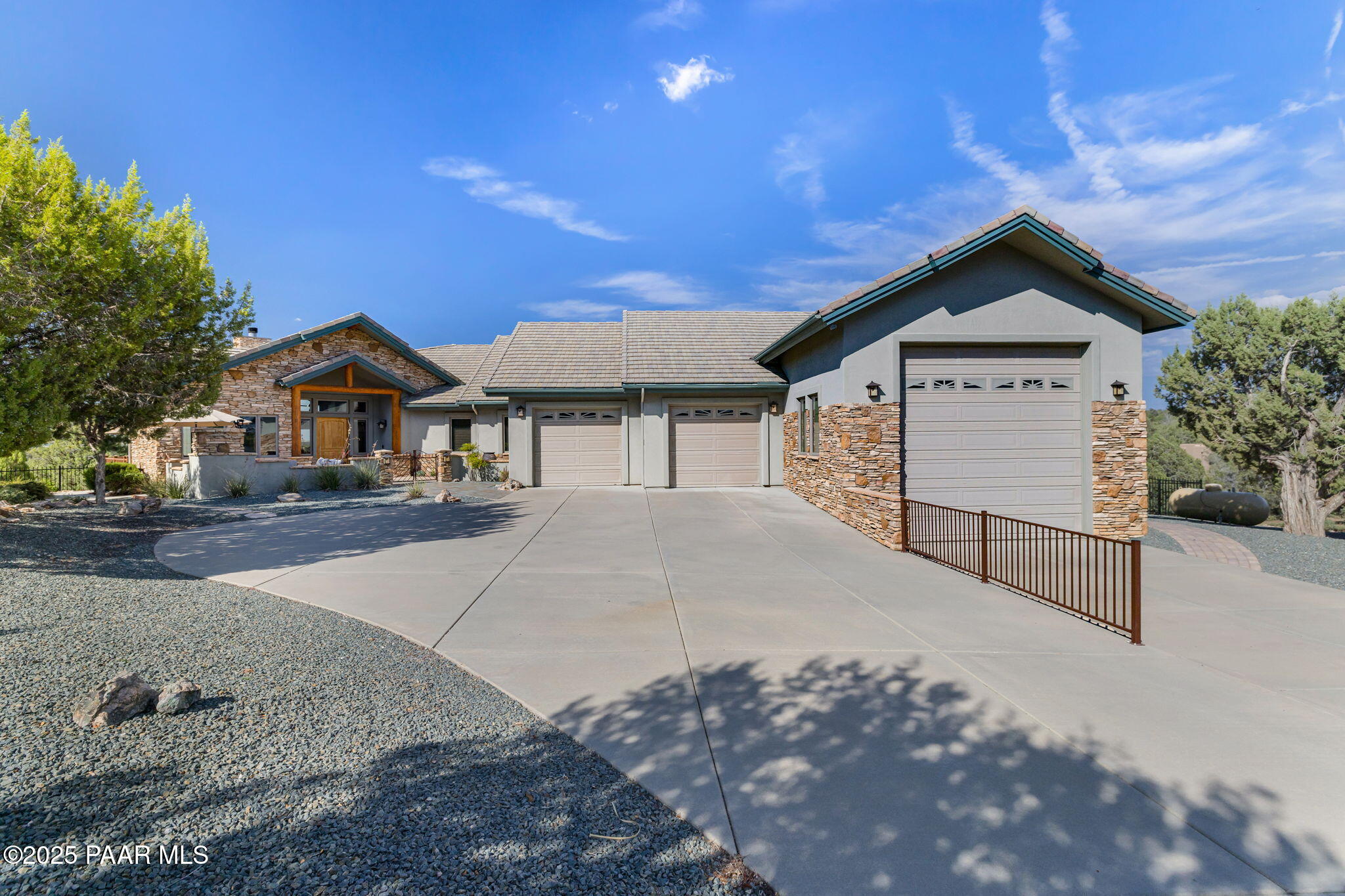 13995 North Thunderbird Road, Unit 74 Prescott, AZ 86305 - Photo 61 of 63 a front view of a house with a yard and garage