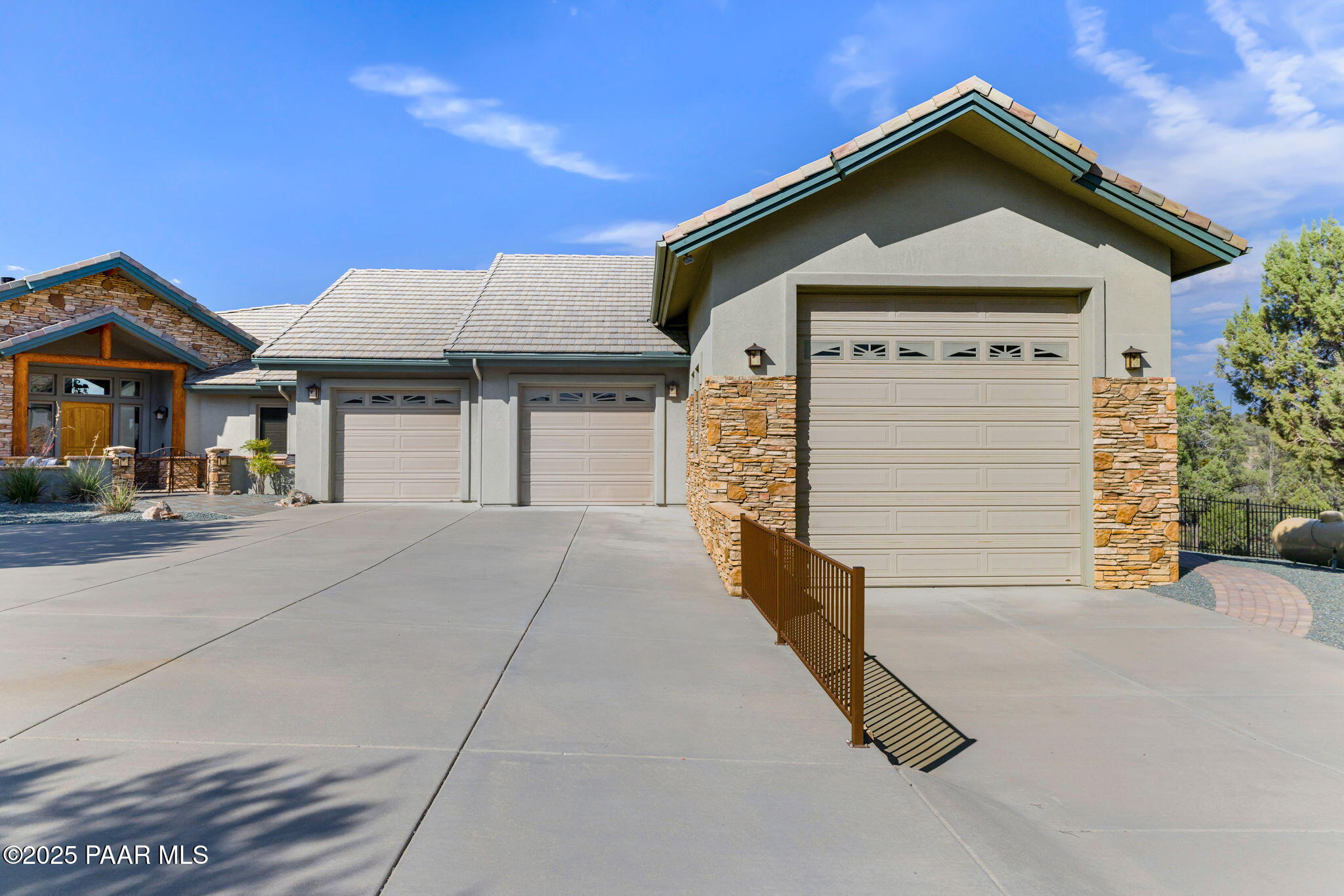 13995 North Thunderbird Road, Unit 74 Prescott, AZ 86305 - Photo 62 of 63 a front view of a house with a garage