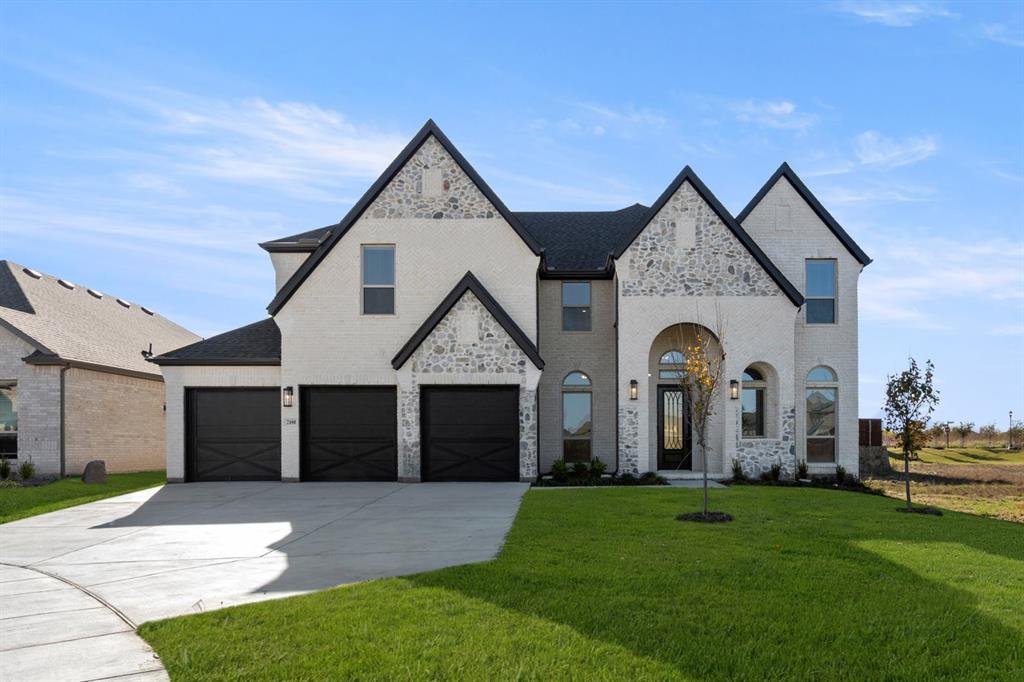 a front view of a house with a garden and plants