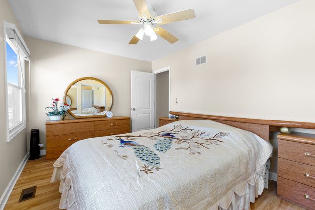 a bedroom with bed and a dresser