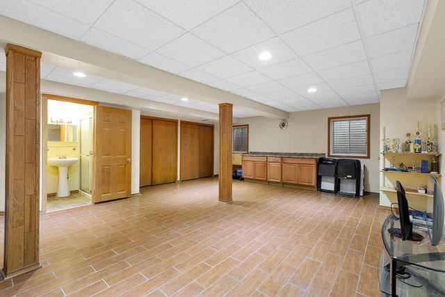 a view of a livingroom with furniture and a workspace