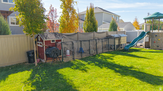 368 East 700 North Springville, UT 84663 - Photo 44 of 55 Fenced backyard featuring an outdoor structure, a playground, and exterior structure