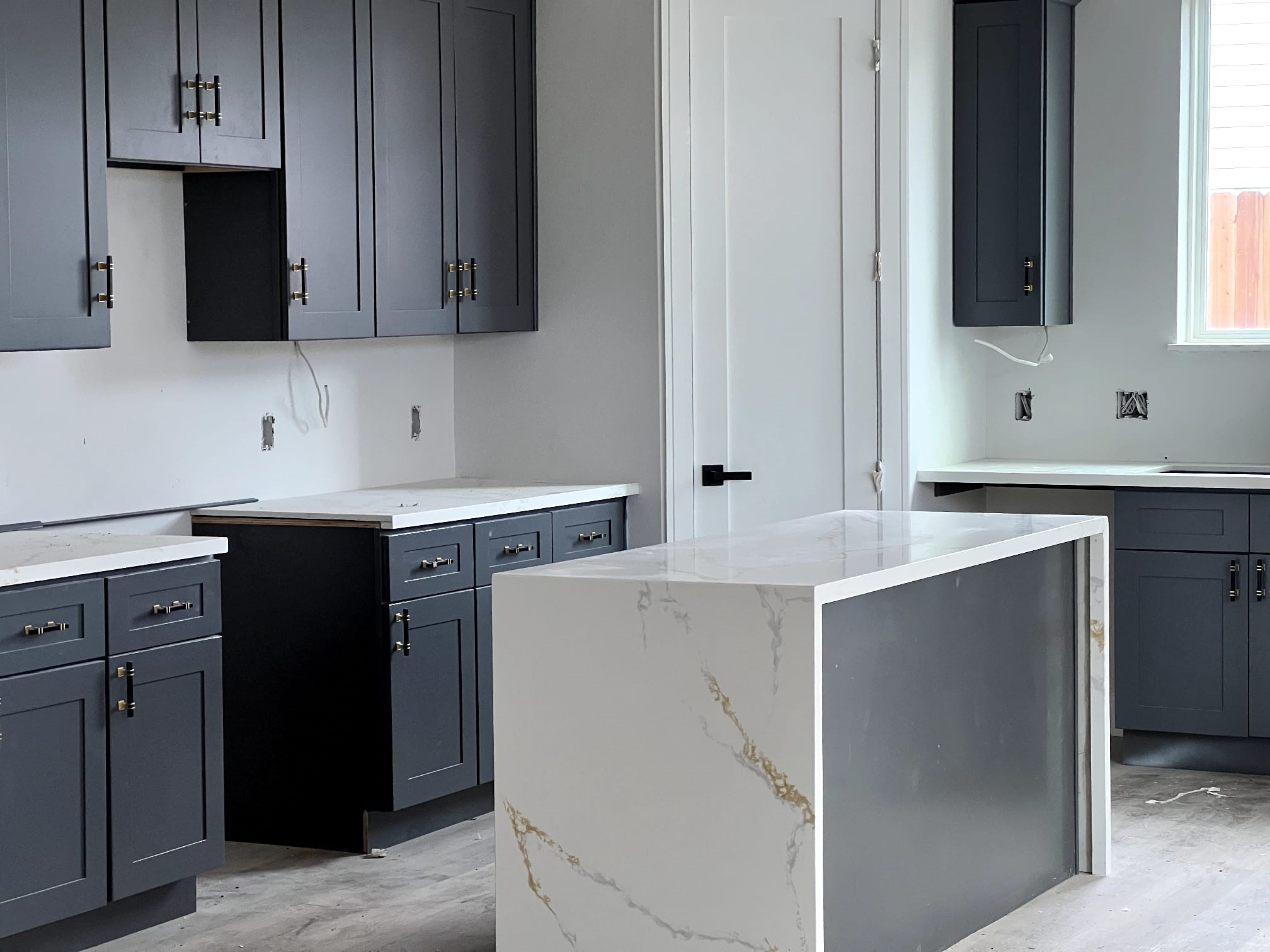 6405 Sidney Street Houston, TX 77021 - Photo 3 of 9 a kitchen with a sink and a stove top oven