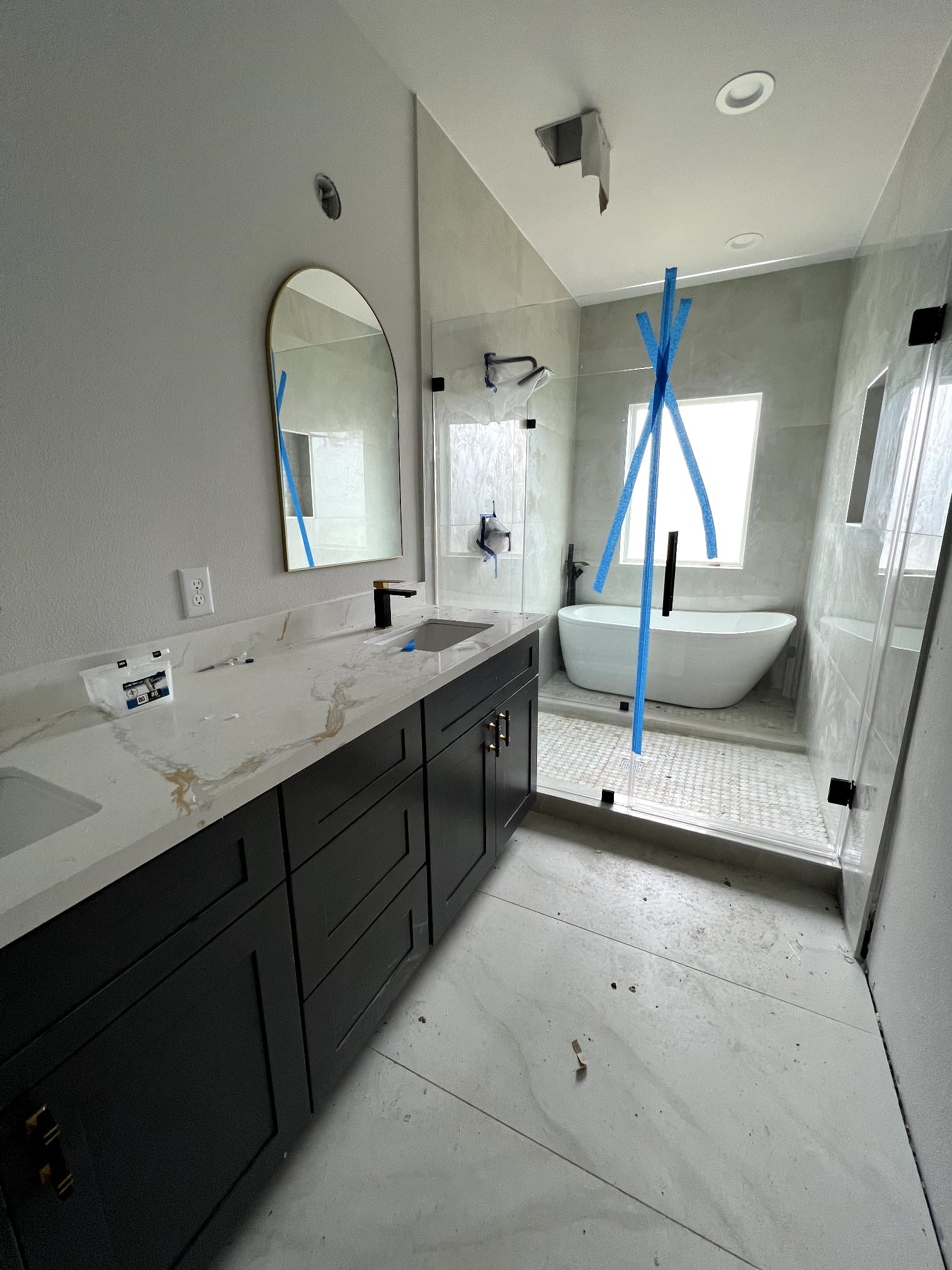 6405 Sidney Street Houston, TX 77021 - Photo 5 of 9 a bathroom with a double vanity sink a mirror and a bathtub