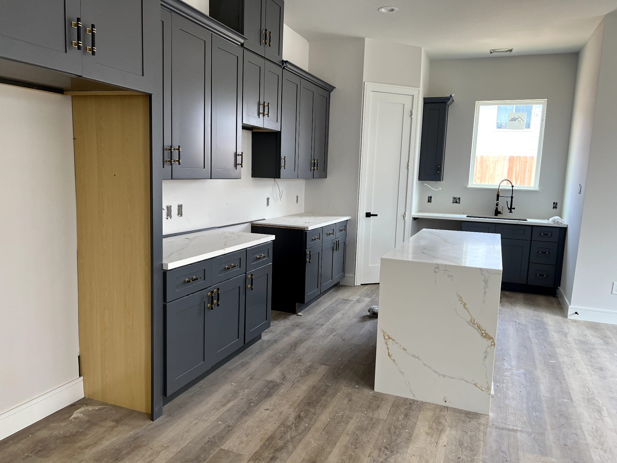 6405 Sidney Street Houston, TX 77021 - Photo 6 of 9 a large kitchen with cabinets and stainless steel appliances