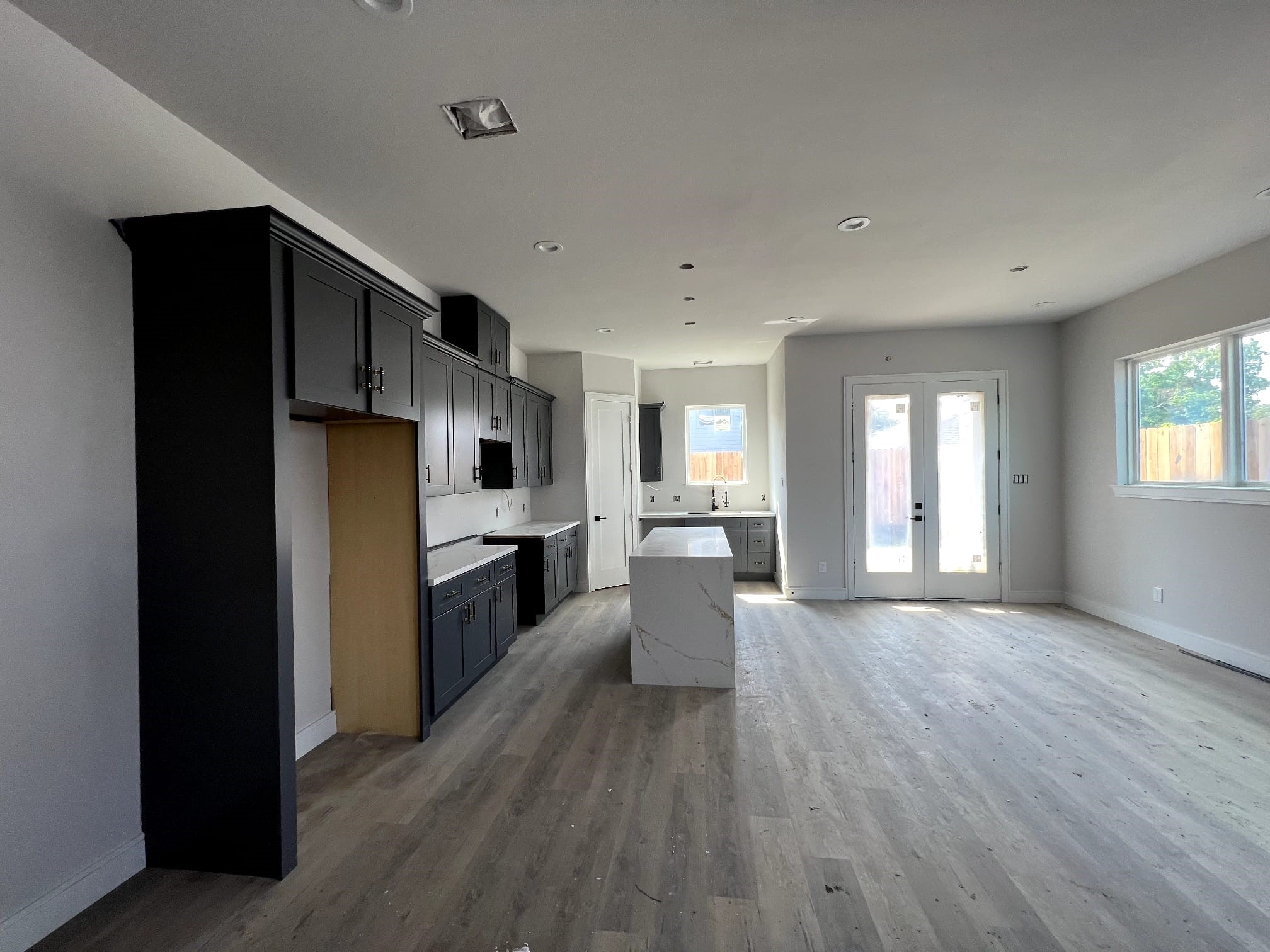 6405 Sidney Street Houston, TX 77021 - Photo 8 of 9 a kitchen with stainless steel appliances a refrigerator and wooden floor