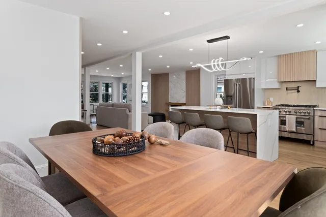 a large kitchen with a table and chairs