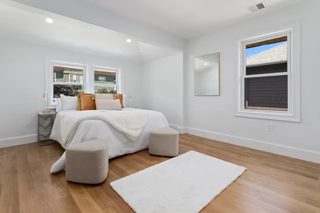 a bedroom with furniture and a window