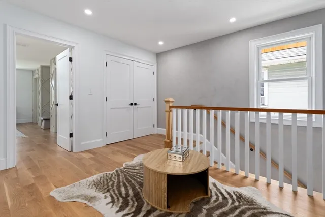 a view of a livingroom with furniture window and wooden floor