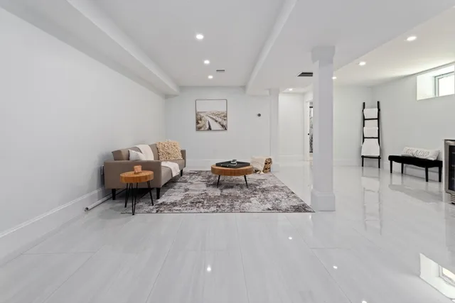 a living room with furniture and a rug