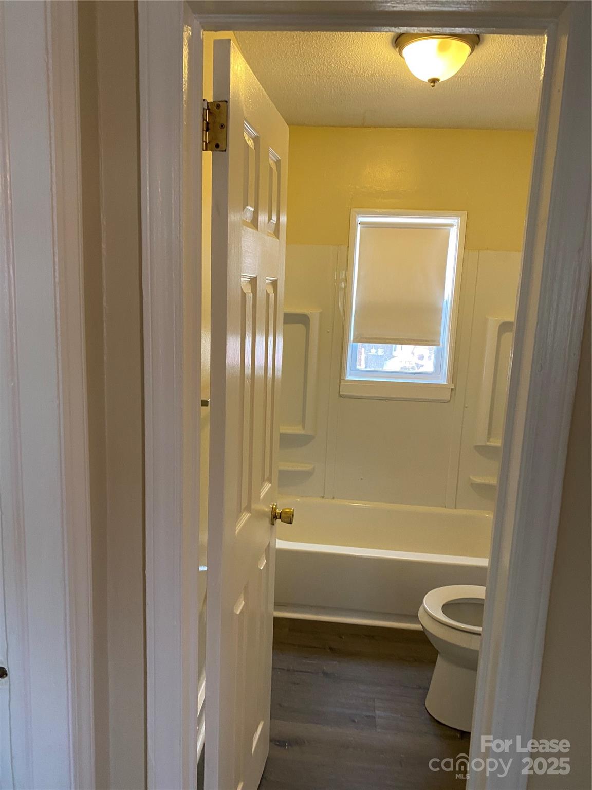 3100 Zircon Street, Unit 1 Charlotte, NC 28205 - Photo 3 of 7 a bathroom with a toilet and a shower