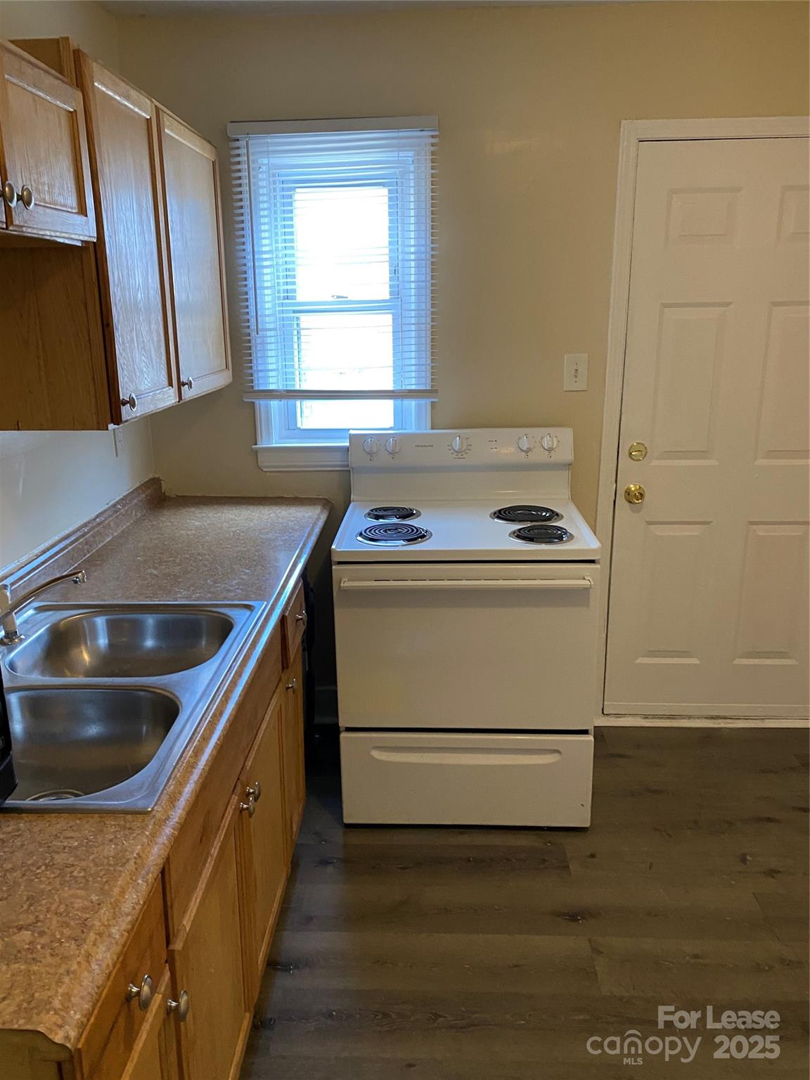 3100 Zircon Street, Unit 1 Charlotte, NC 28205 - Photo 6 of 7 a kitchen with a sink stove and cabinets