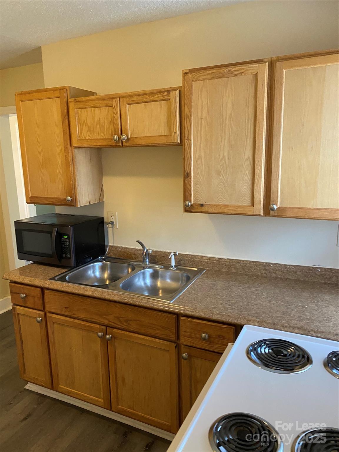3100 Zircon Street, Unit 1 Charlotte, NC 28205 - Photo 7 of 7 a kitchen with a sink and cabinets