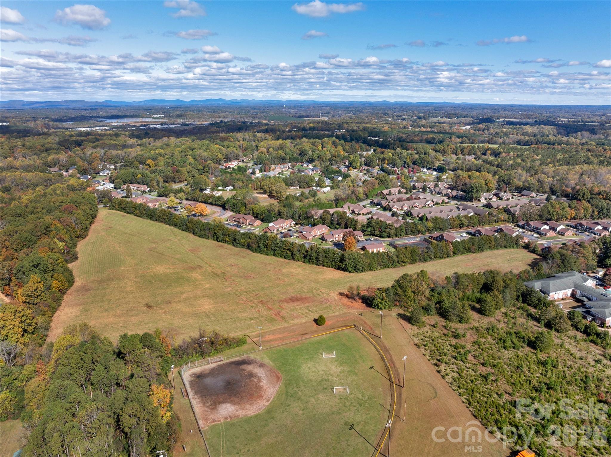 406 Rock Barn Road Northeast Conover, NC 28613 - Photo 2 of 10 an aerial view of residential houses with outdoor space