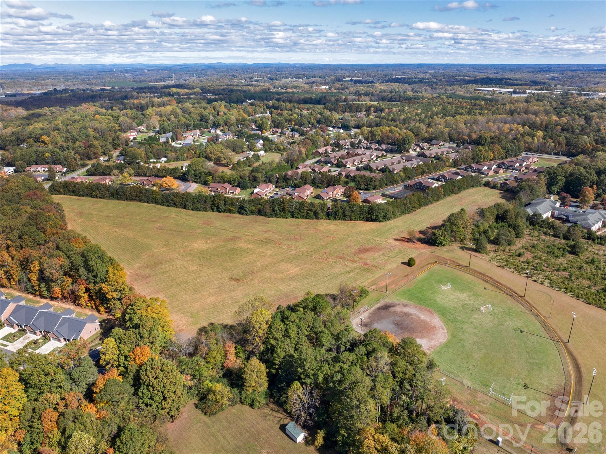 406 Rock Barn Road Northeast Conover, NC 28613 - Photo 3 of 10 an aerial view of ocean and residential houses with outdoor space