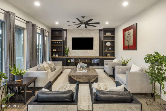 a kitchen with kitchen island granite countertop a sink and refrigerator