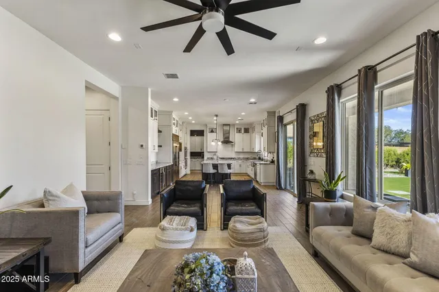 a kitchen with stainless steel appliances granite countertop a kitchen island hardwood floor sink stove and granite counter top