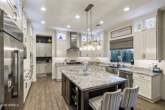 a kitchen with cabinets and a stove