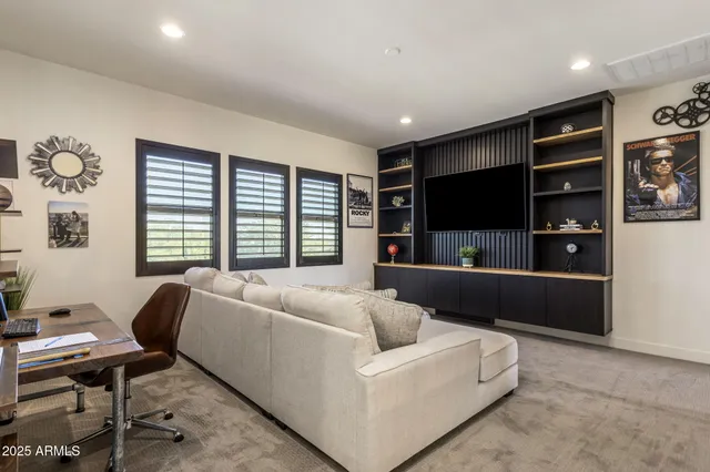 a view of a city from a balcony with furniture