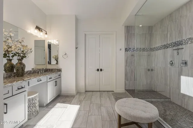 a view of a storage and utility room with washer and dryer