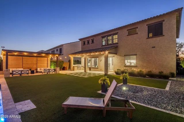 a view of a backyard with swimming pool