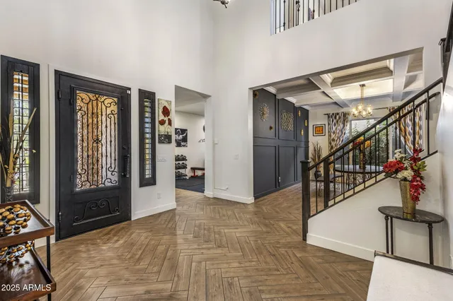 a view of entryway and hall with wooden floor