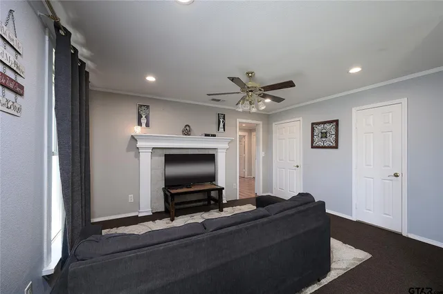 a living room with furniture and a flat screen tv