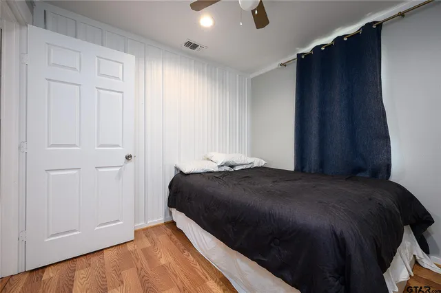 a bedroom with a bed and a closet