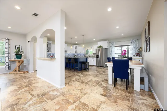 a view of a living room and dining room