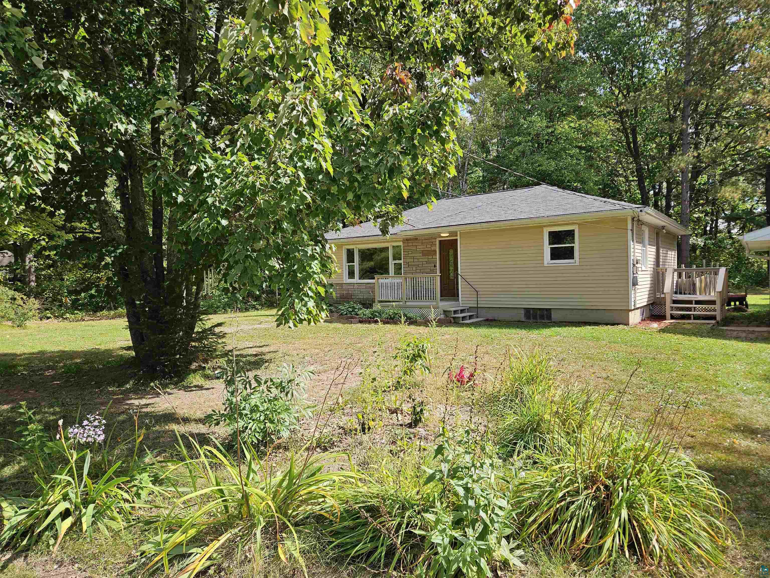 Exterior space with a lawn and a deck