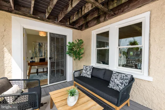 a outdoor living space with furniture and a potted plant