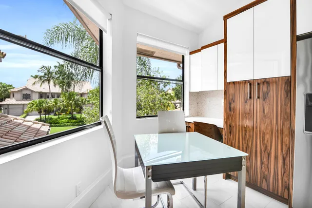 a view of a dining room with furniture window and outside view