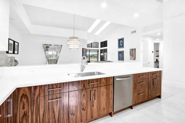 a spacious bathroom with a double vanity sink and mirror