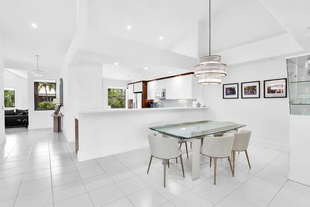 a kitchen with a table and chairs in it