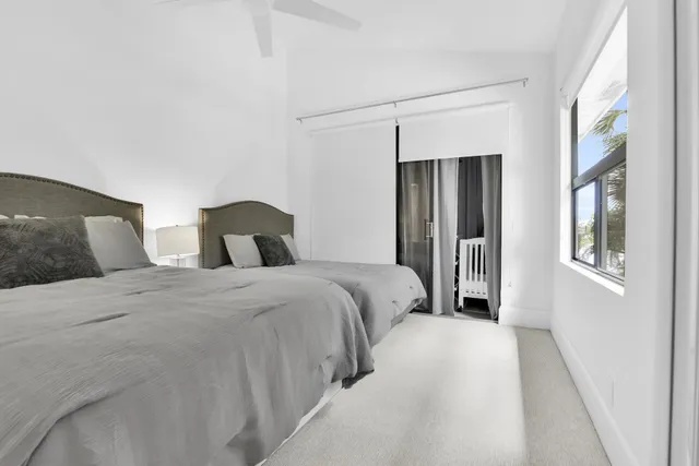 a bedroom with double bed and a window