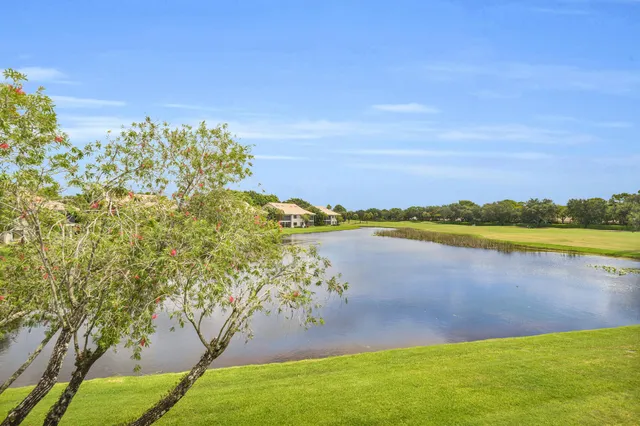 a view of a lake with a yard
