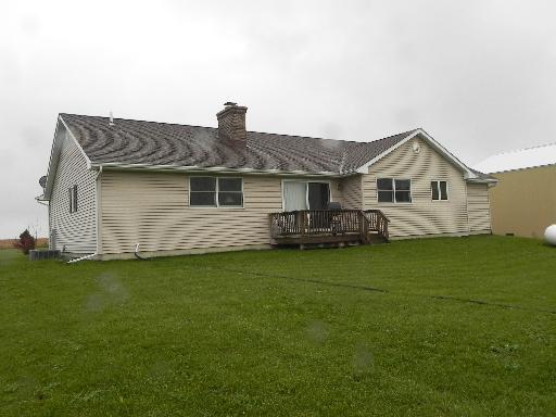 3392 Dredge Road Paw Paw, IL 61353 - Photo 2 of 18 a front view of a house with a garden